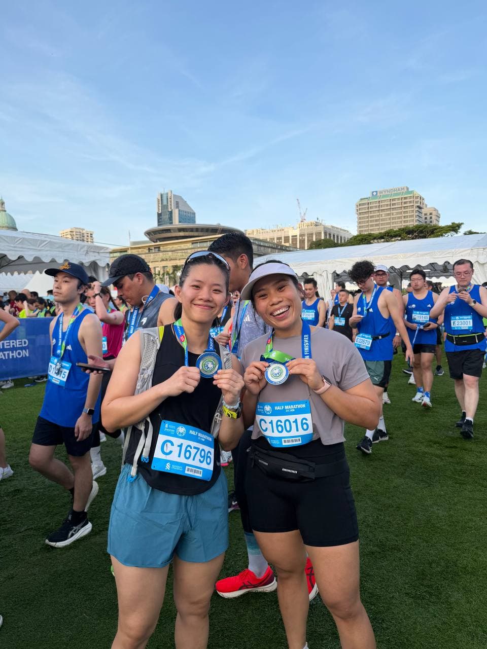 Eugenia Chan with half marathon finisher medal in Singapore