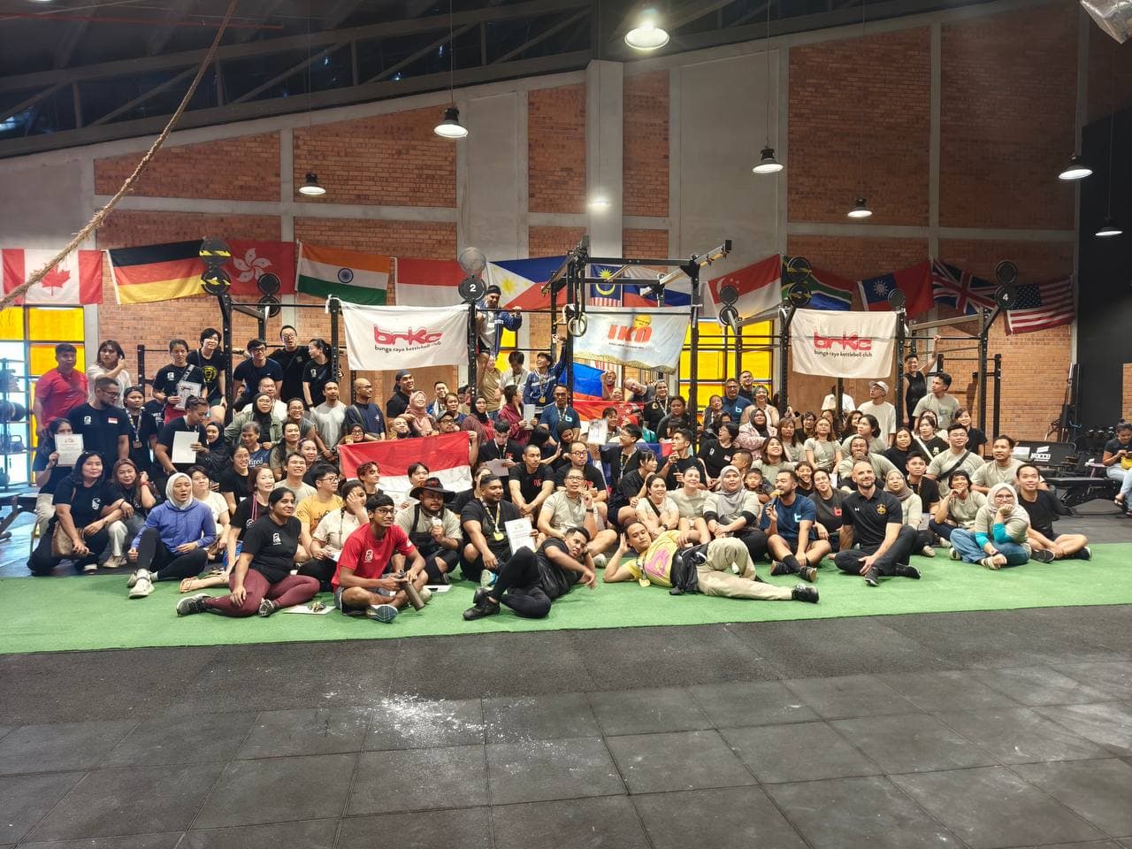 International kettlebell sport competition team photo at IKO Jakarta with flags