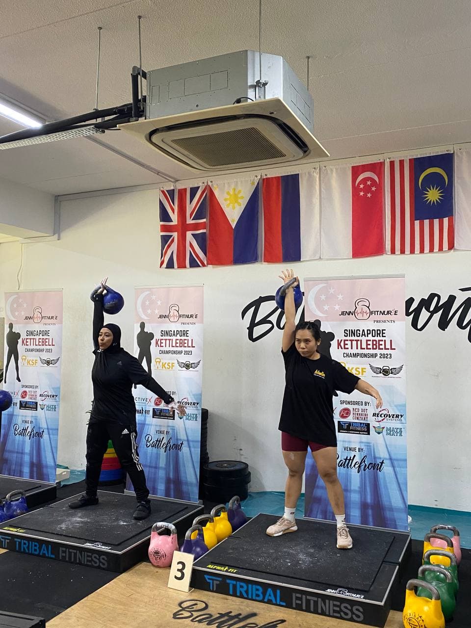 Eugenia Chan performing kettlebell snatch at Singapore Kettlebell Championship 2023