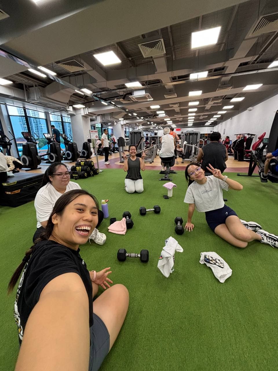 Eugenia Chan with personal training clients at Singapore gym