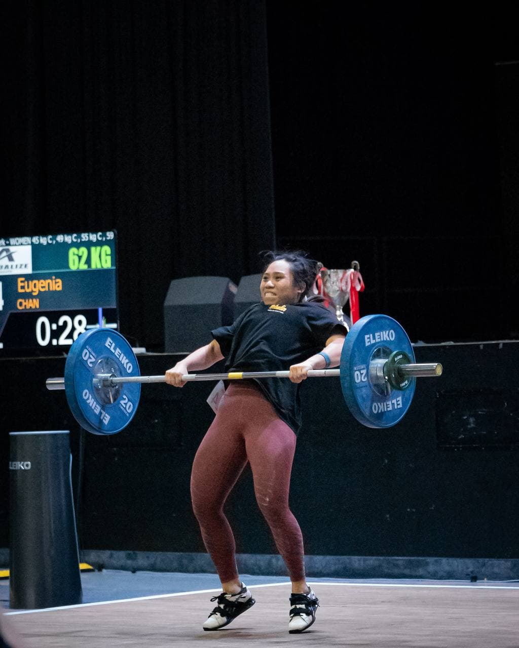 Eugenia Chan competing at 62kg in Olympic weightlifting competition